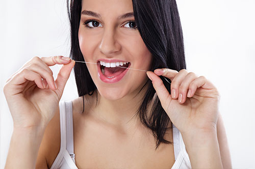 Flossing Tips to Master Oral Care During the Busy Holiday Season